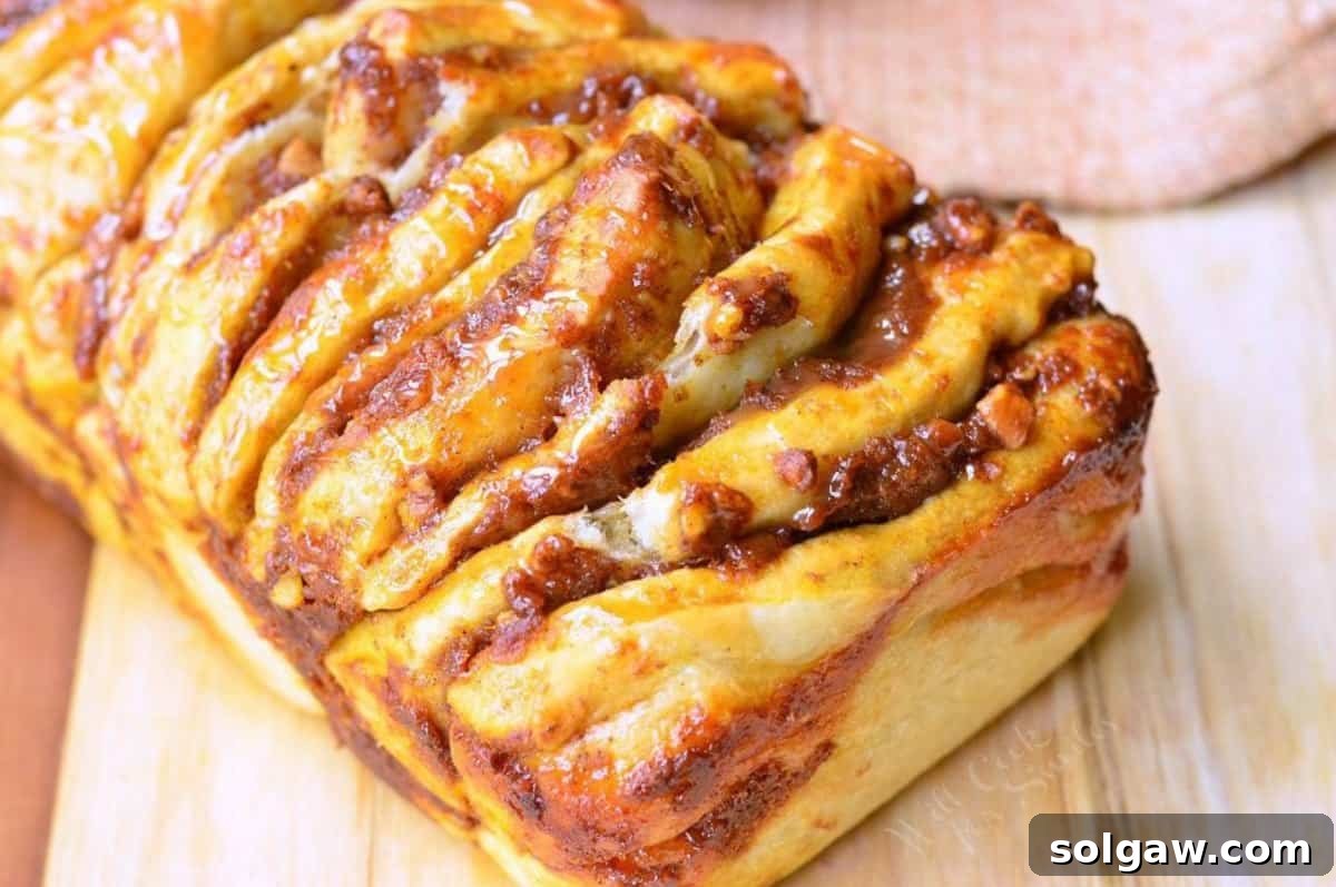 Spiced Pumpkin Pull-Apart Loaf 7 pumpkin pull apart bread with pecans and drizzled caramel on top/