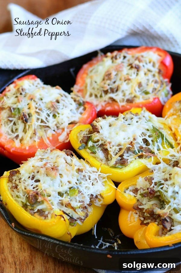 Ultimate Italian Sausage Lasagna 10 Delicious Sausage & Onion Stuffed Peppers with melted shredded cheese on top, served in a cast iron pan.