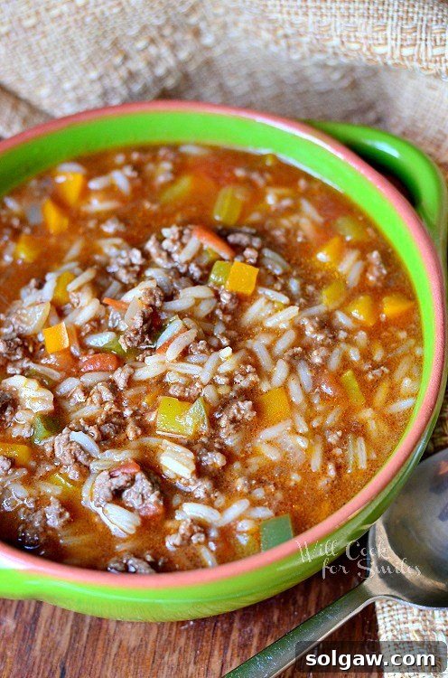 Hearty Stuffed Peppers Soup in a vibrant green soup bowl