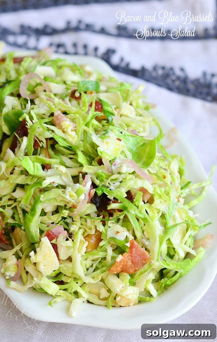 Small white bowl filled with a Bacon and Blue Brussels Sprouts Salad
