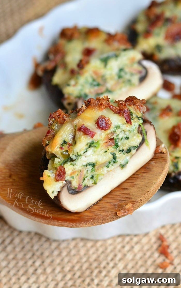 Close-up of baked Bacon Spinach and Four Cheese Stuffed Mushrooms