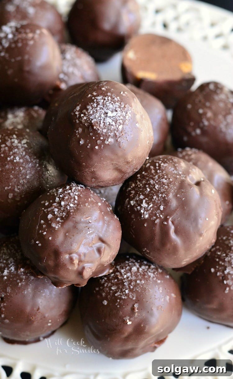 Salted Almond Fudge Truffles stacked onto a platter 