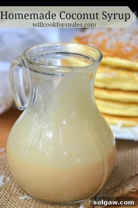 Homemade Coconut Syrup in a glass container, with a smooth, rich texture.