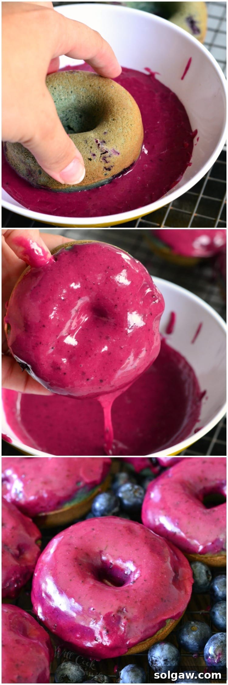 A delectable blueberry doughnut being dipped into a bowl of creamy blueberry whiskey glaze, showing the rich texture of the glaze.