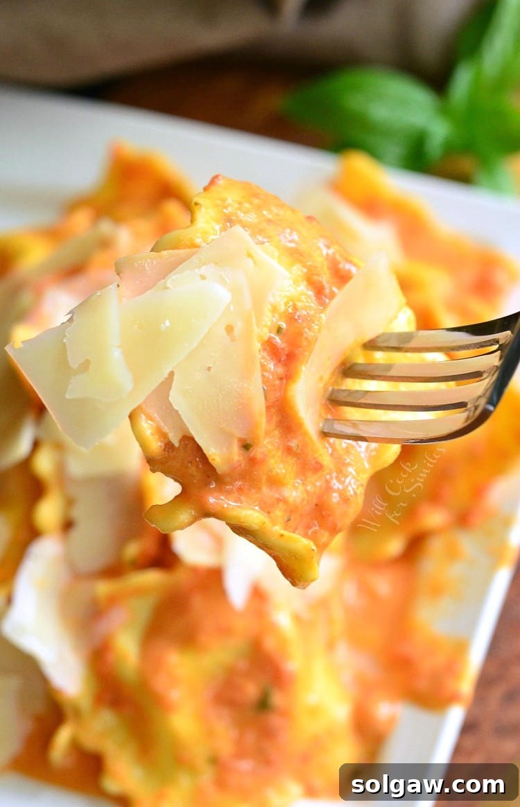 Ravioli being lifted off plate with a fork
