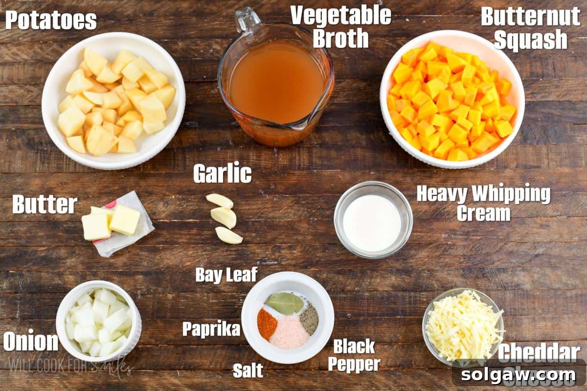 A selection of key ingredients for butternut squash potato soup, neatly labeled and arranged on a rustic wooden board.