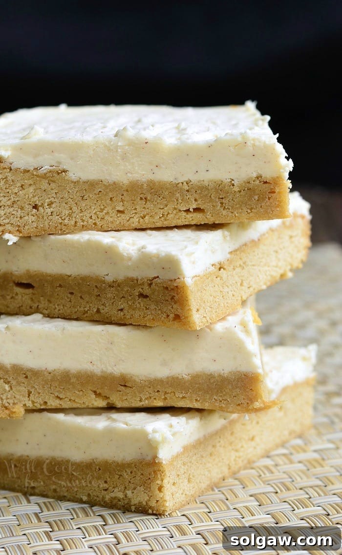 Golden Brown Butter Cinnamon Bars 7 Frosted Maple Cookie Bars stacked up on a placemat