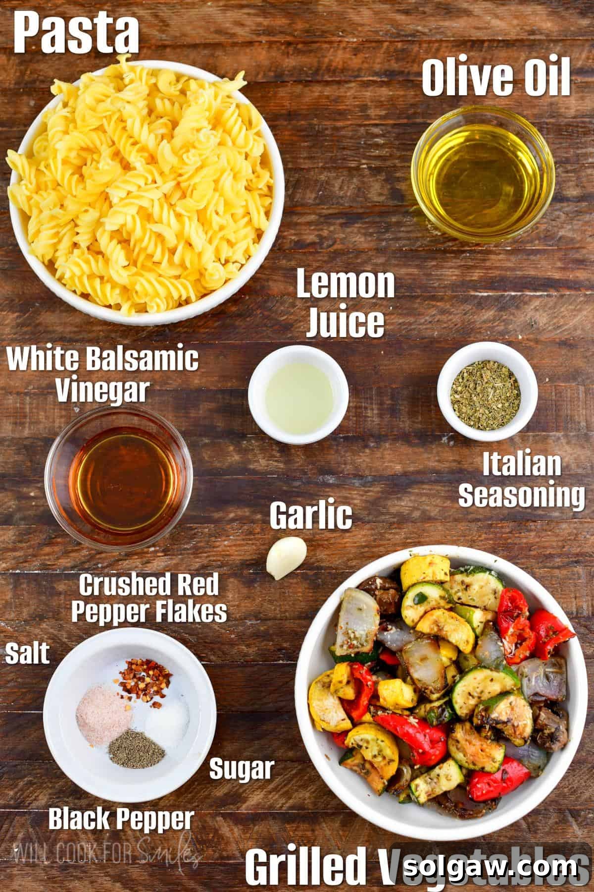 Smoky Grilled Veggie Pasta Salad 3 Labeled ingredients for Grilled Vegetables Pasta Salad laid out on a rustic wood surface.