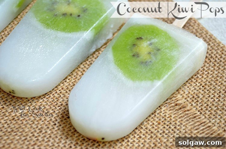 Four Coconut Kiwi ice pops arranged on a piece of burlap fabric