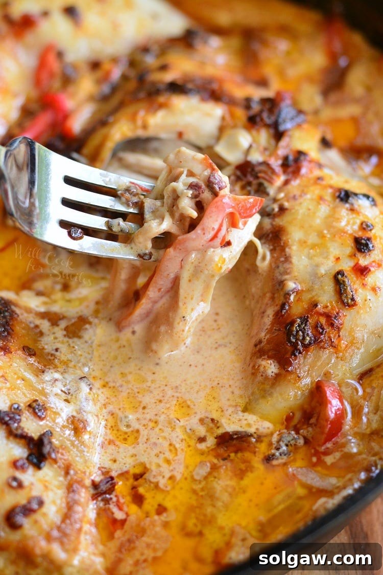 Creamy Chipotle Pepper Chicken Thighs with a fork