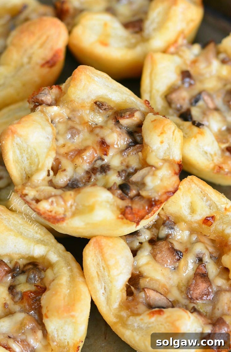 Mushroom Cheese Puff Bites. Buttery, cheesy, tasty little cups of mushroom filled pastry. Only 5 ingredients and 30 minutes of your time to get these heavenly mushroom cheese bites. #mushrooms #partyfood #puffpastry