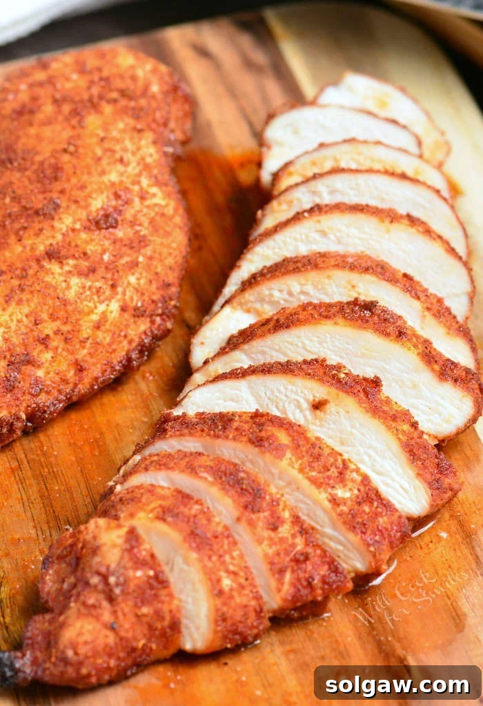 Baked Chicken sliced on cutting board