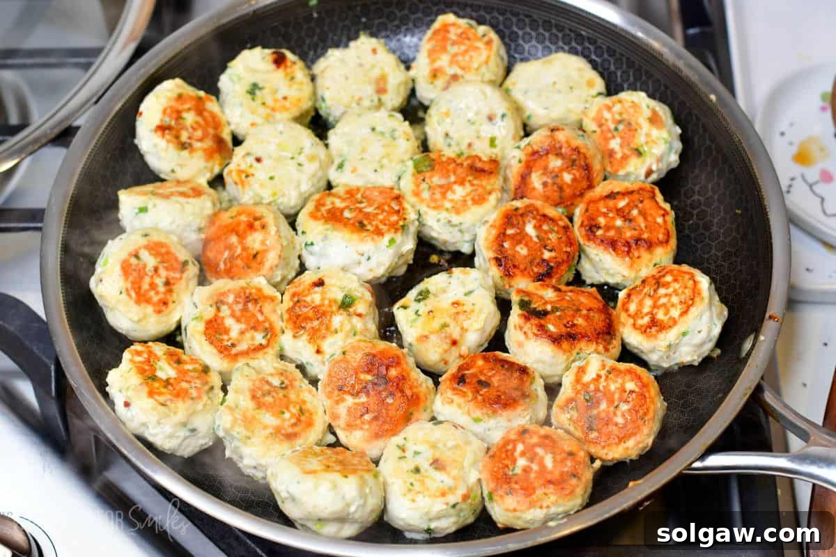 Sweet Chili Glazed Turkey Meatballs 5 Thai Sweet Chili Turkey Meatballs cooking in a pan on the stove top.