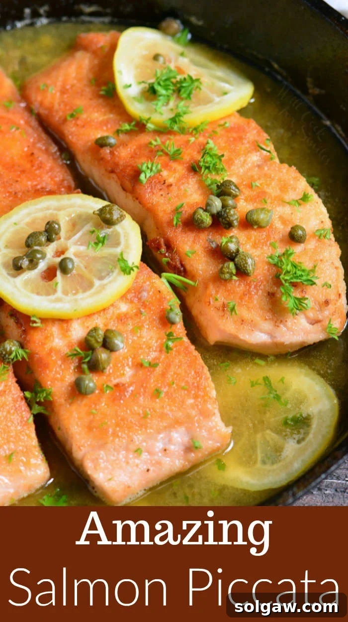 Beautiful Salmon Piccata dish with lemon and caper sauce in a cast iron pan