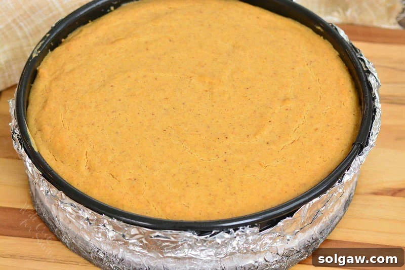 Velvet Sweet Potato Cheesecake 5 Baked sweet potato cheesecake on a wooden cutting board