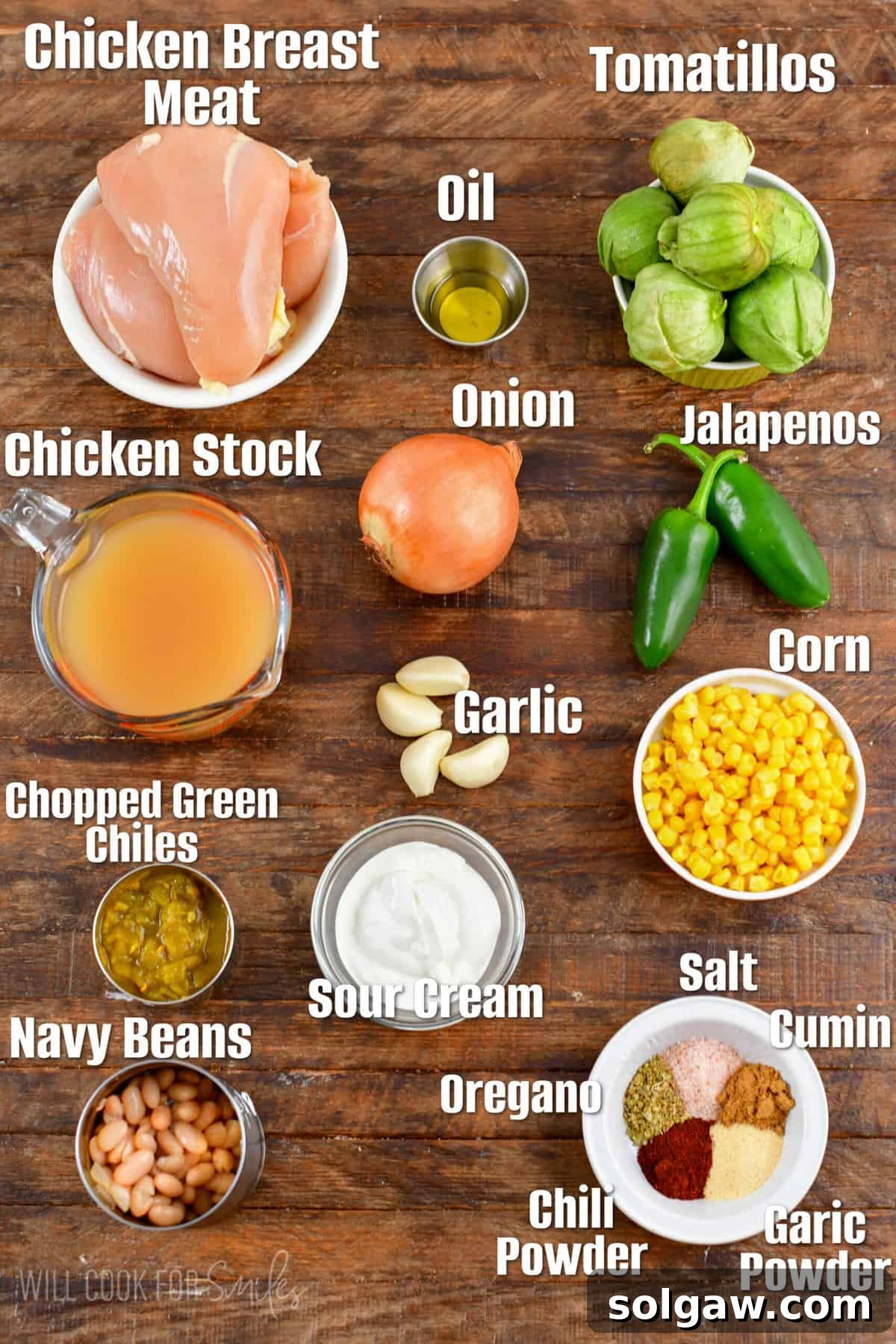 Creamy White Chicken Chili 3 labeled ingredients for white chicken chili on a wood cutting board.