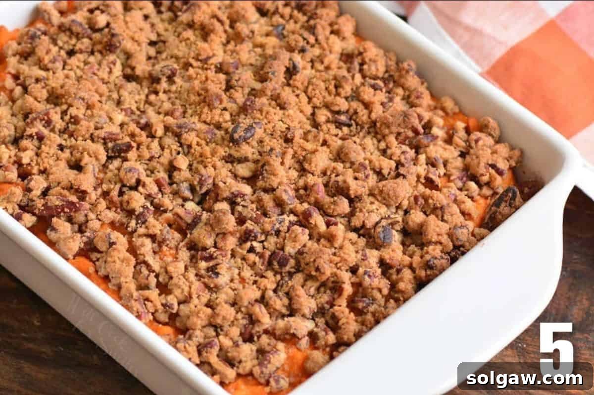 sweet potato casserole with pecan crumble topping baked.
