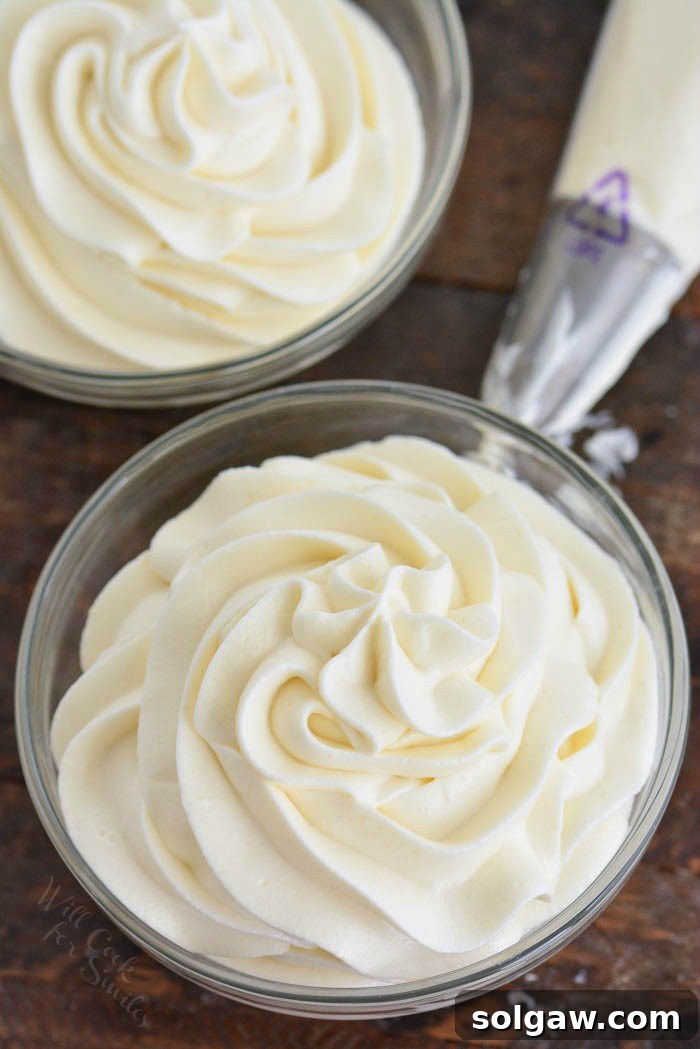 A beautifully decorated cake with smooth cream cheese frosting, showcasing its perfect texture.