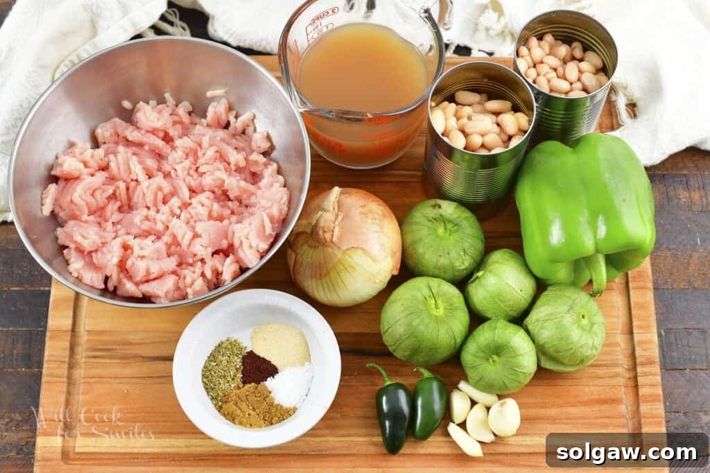 Close-up shot of White Turkey Chili in a pot, simmering gently with visible beans and turkey chunks.