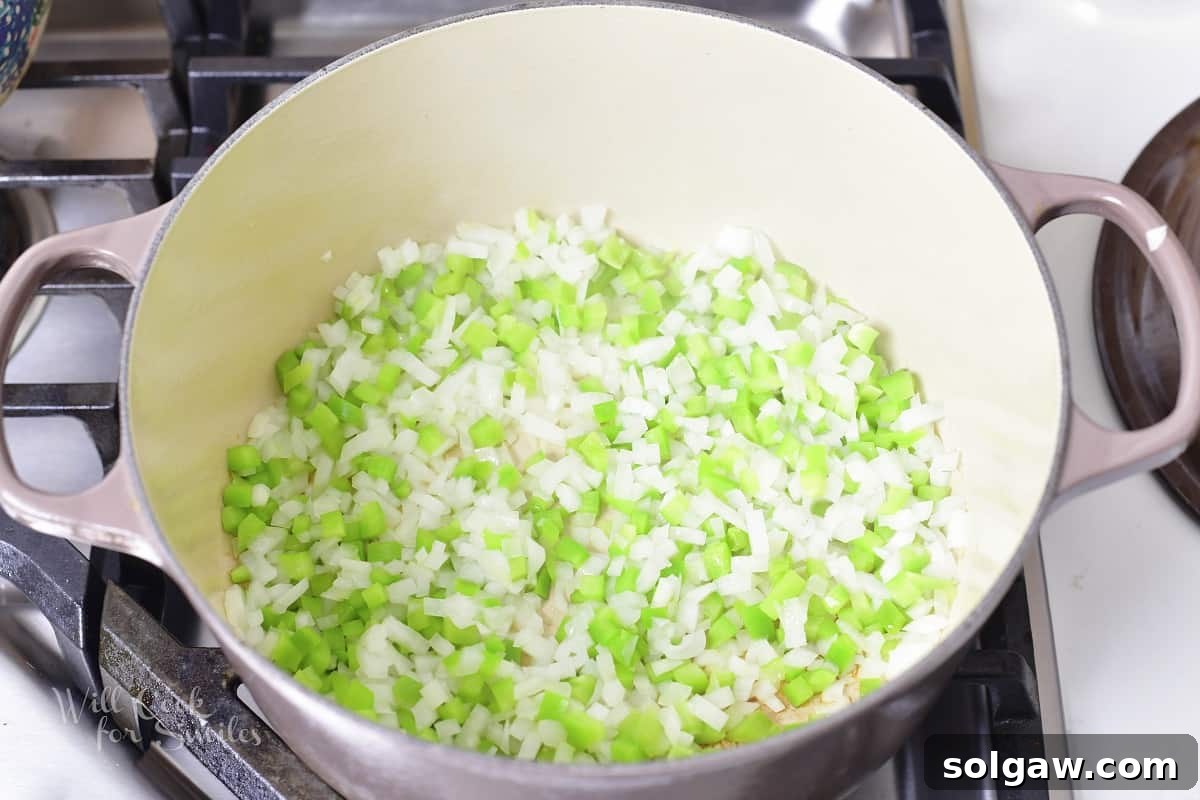 Diced onions, bell peppers, and jalapeños ready for cooking.
