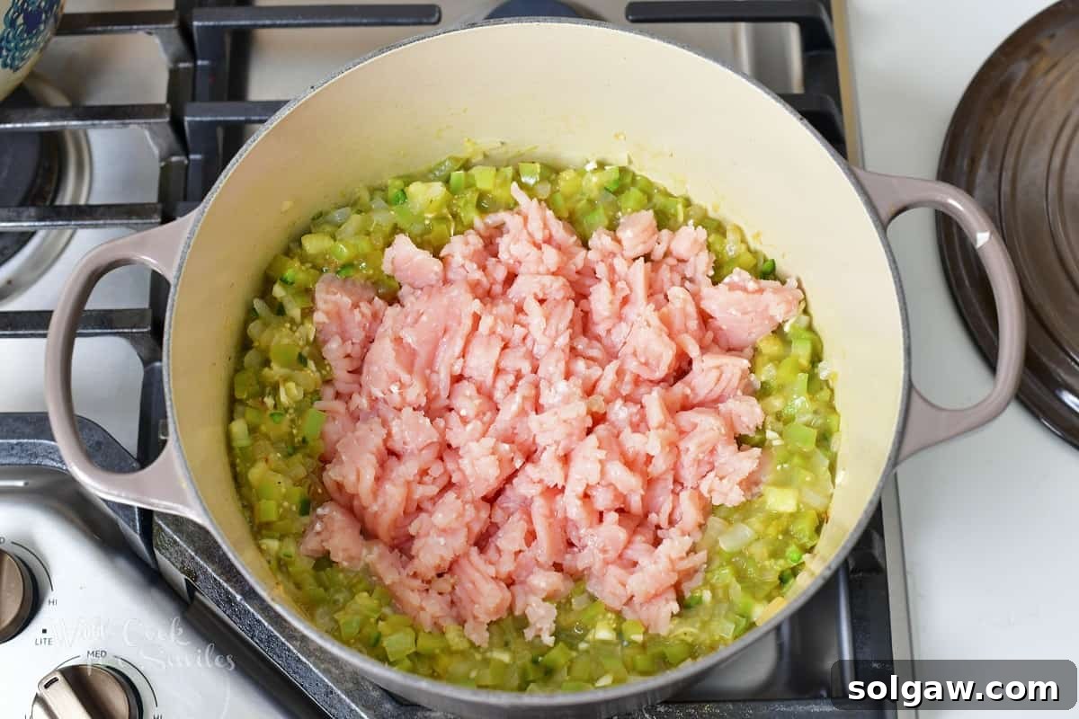 Ground turkey in a pan, ready to be cooked.