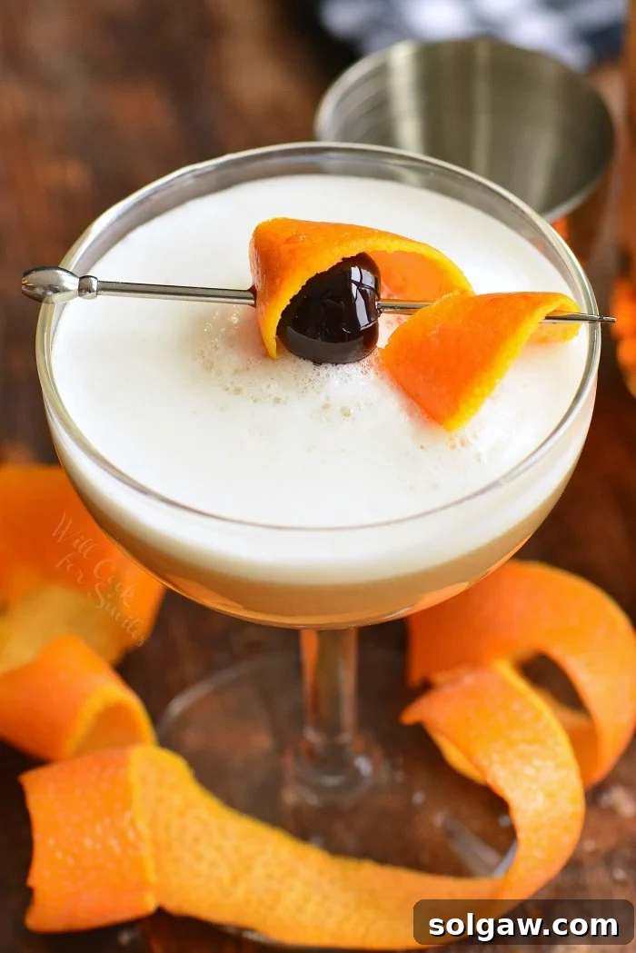 Whiskey Sour with egg white for a frothy finish.