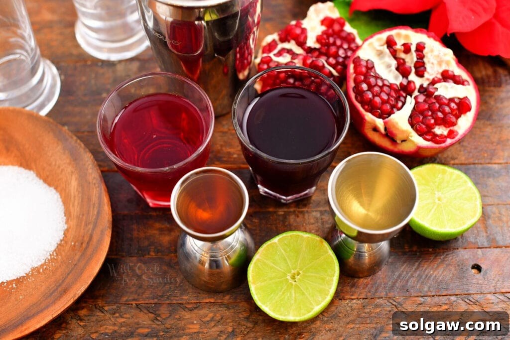 ingredients measures in glasses for the cocktail with open pomegranate next to it