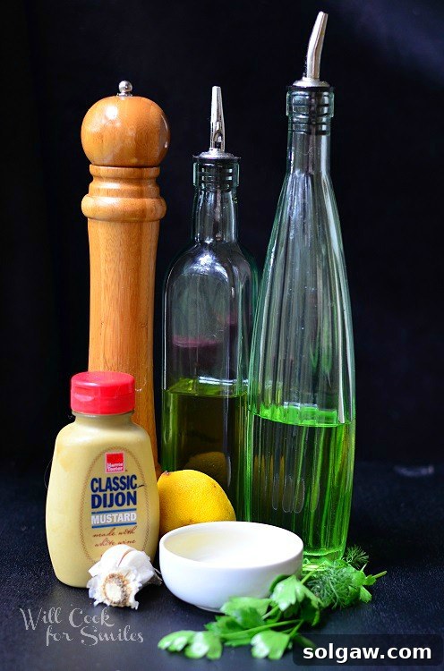 Coastal Tuna Pita with Bright Herb Aioli 5 Ingredients for a homemade herb aioli, showcasing fresh herbs, garlic, and mayonnaise, on a pristine white surface