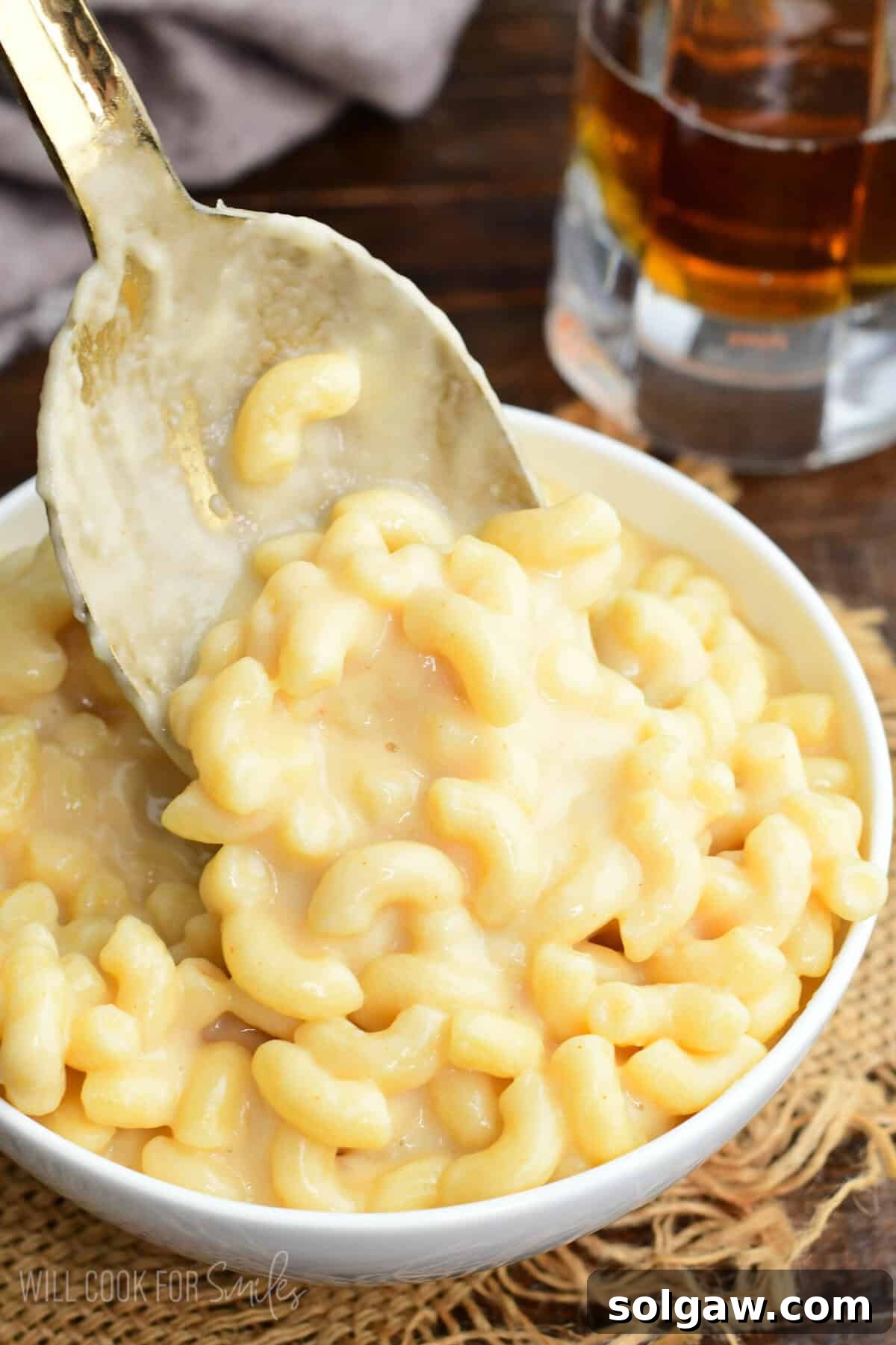Craft Beer Mac and Cheese 8 Creamy homemade beer macaroni and cheese in a bowl with a spoon lifting cheesy elbow pasta coated in rich beer cheese sauce.