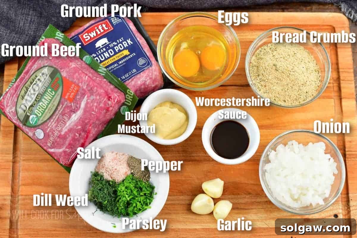 Clearly labeled ingredients for making a delicious meatloaf, arranged on a wooden cutting board.