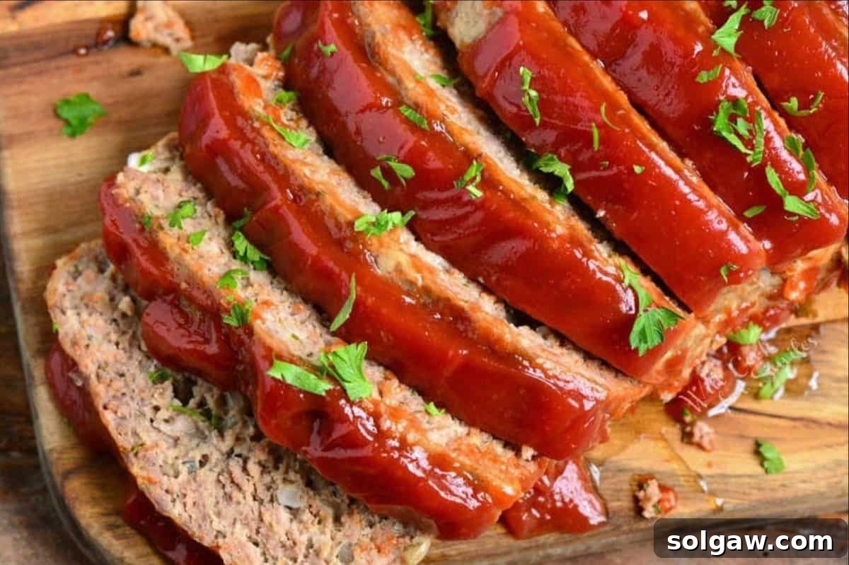 Sliced meatloaf on a cutting board, ready to serve.