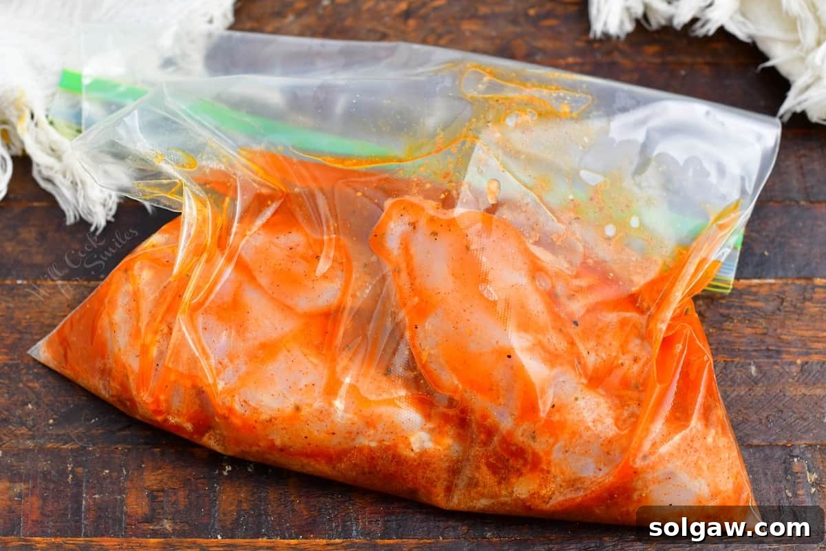 Sizzling Chicken Fajitas 4 Chicken strips marinating in a zip-top bag with the homemade fajita marinade.