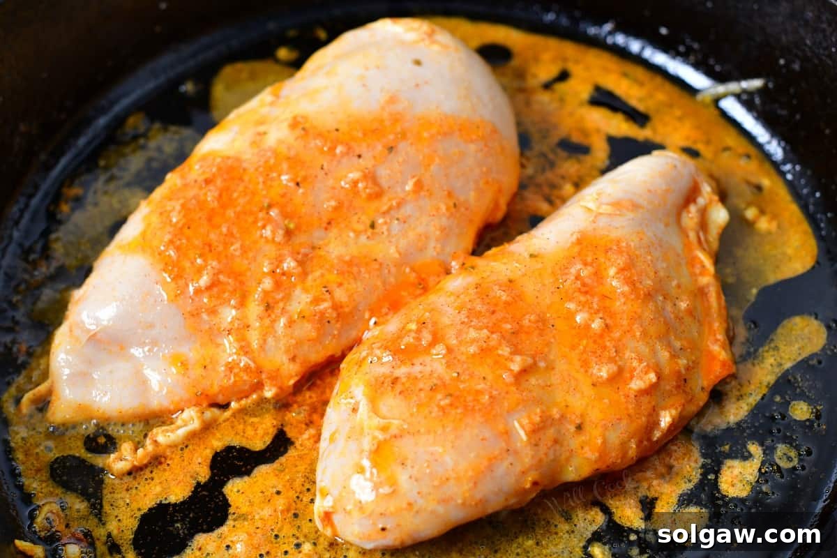 Sizzling Chicken Fajitas 7 Marinated chicken strips are added to a hot skillet, ready to sizzle.