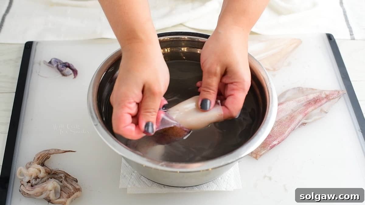 pulling the skin off the squid