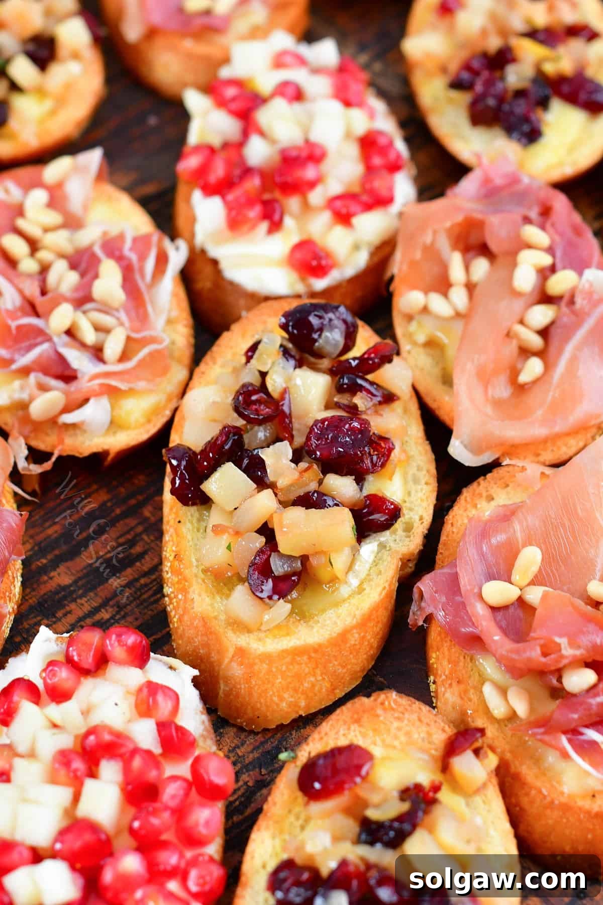 closeup of pomegranate pear brie crostini