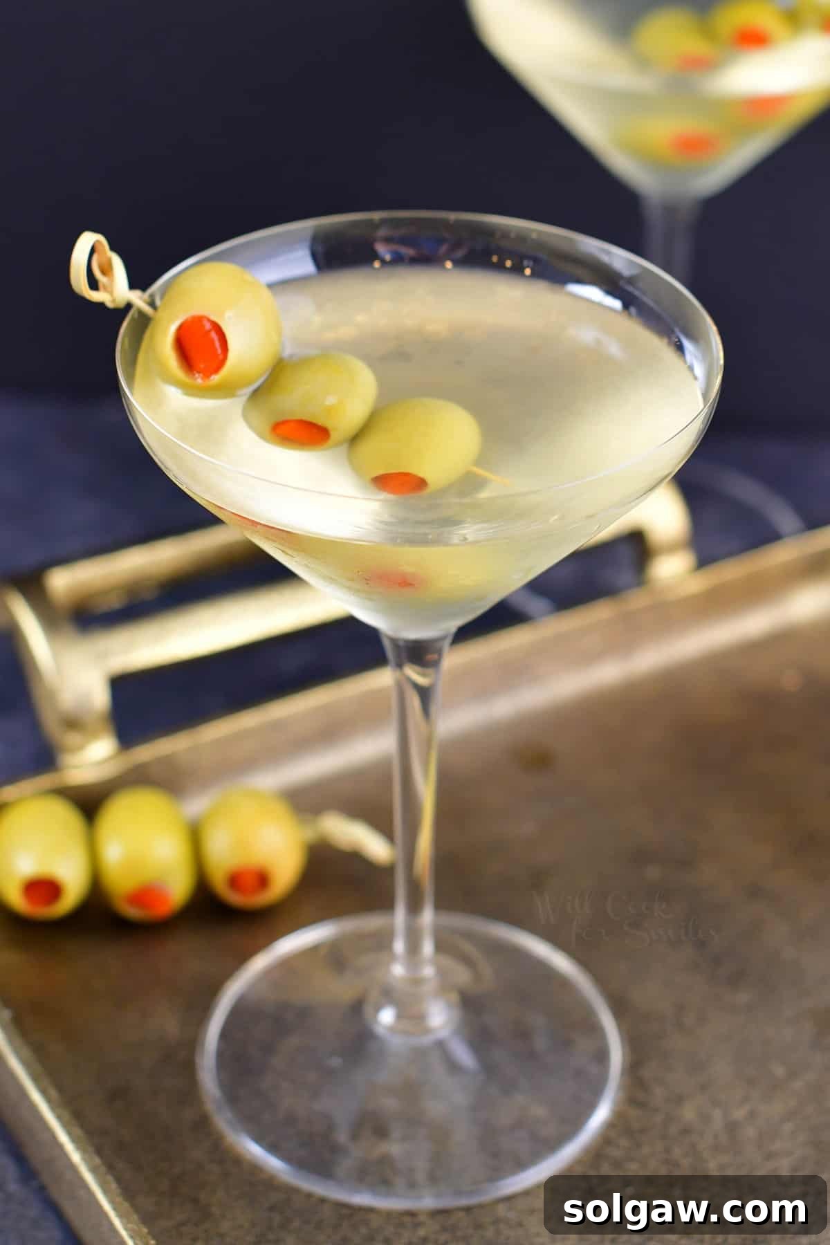 The Maverick's Martini 9 closeup view of the martini with olives in a glass