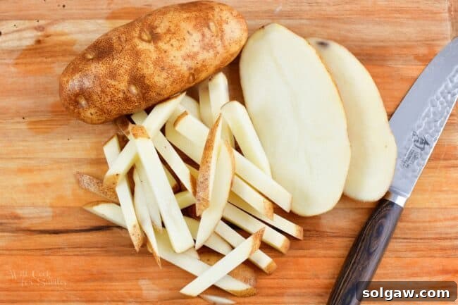 Homemade Poutine Perfection 4 Idaho potato next to another potato sliced