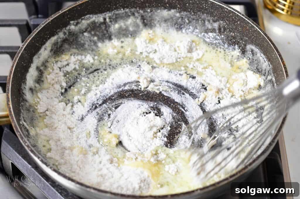 Homemade Poutine Perfection 9 mixing in flour with butter in a pan