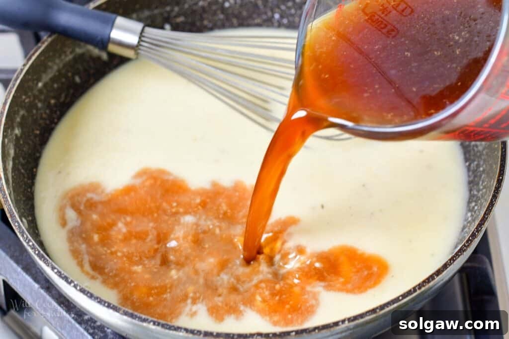 Homemade Poutine Perfection 10 adding beef stock to the gravy