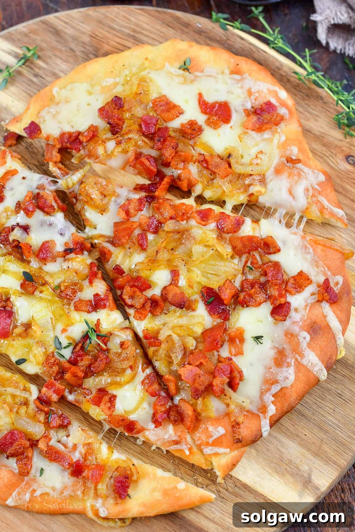 Sweet Golden Onion Smoky Bacon Gruyere Flatbread 15 top view of sliced flatbread on the wood board