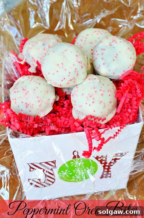 Cool Mint Oreo Delights 2 Beautifully arranged Peppermint Oreo Bites in a cheerful red and white striped container, perfect for holiday gatherings or a thoughtful homemade gift.
