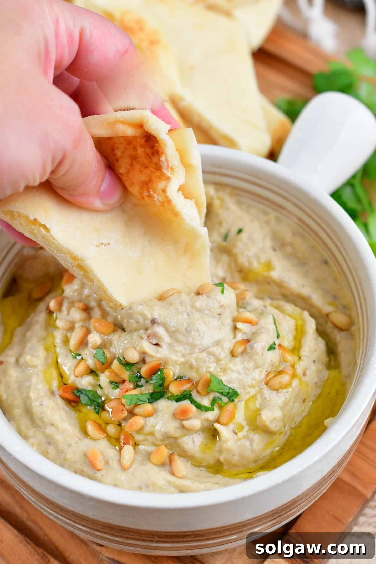 Smoky Aubergine Mezze 2 Scooping creamy Baba Ganoush with warm pita bread