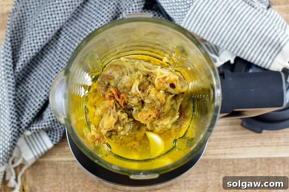 Smoky Aubergine Mezze 8 All Baba Ganoush ingredients, including roasted eggplant flesh, in a blender bowl