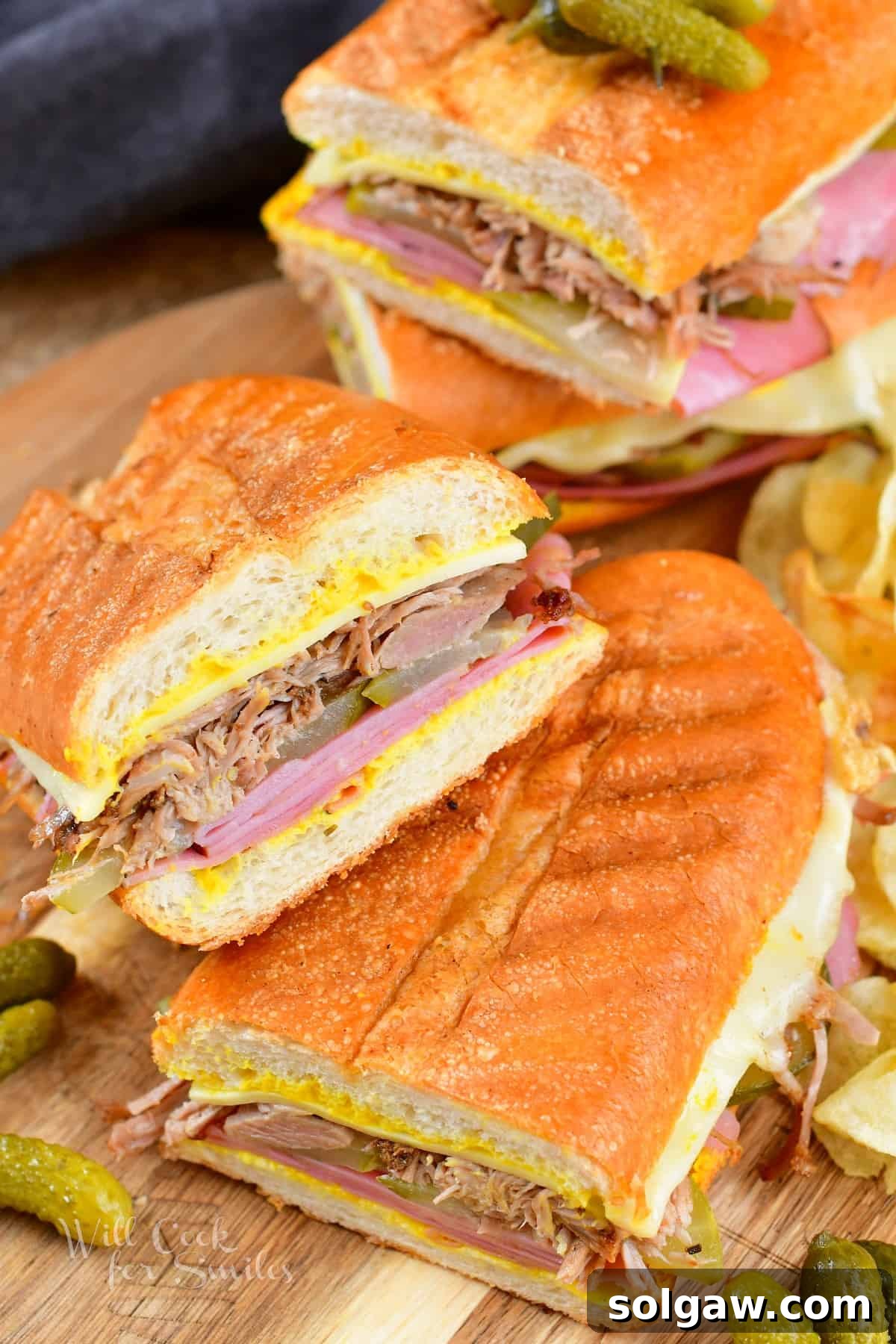 sliced Cuban sandwich halves stacked on the angle