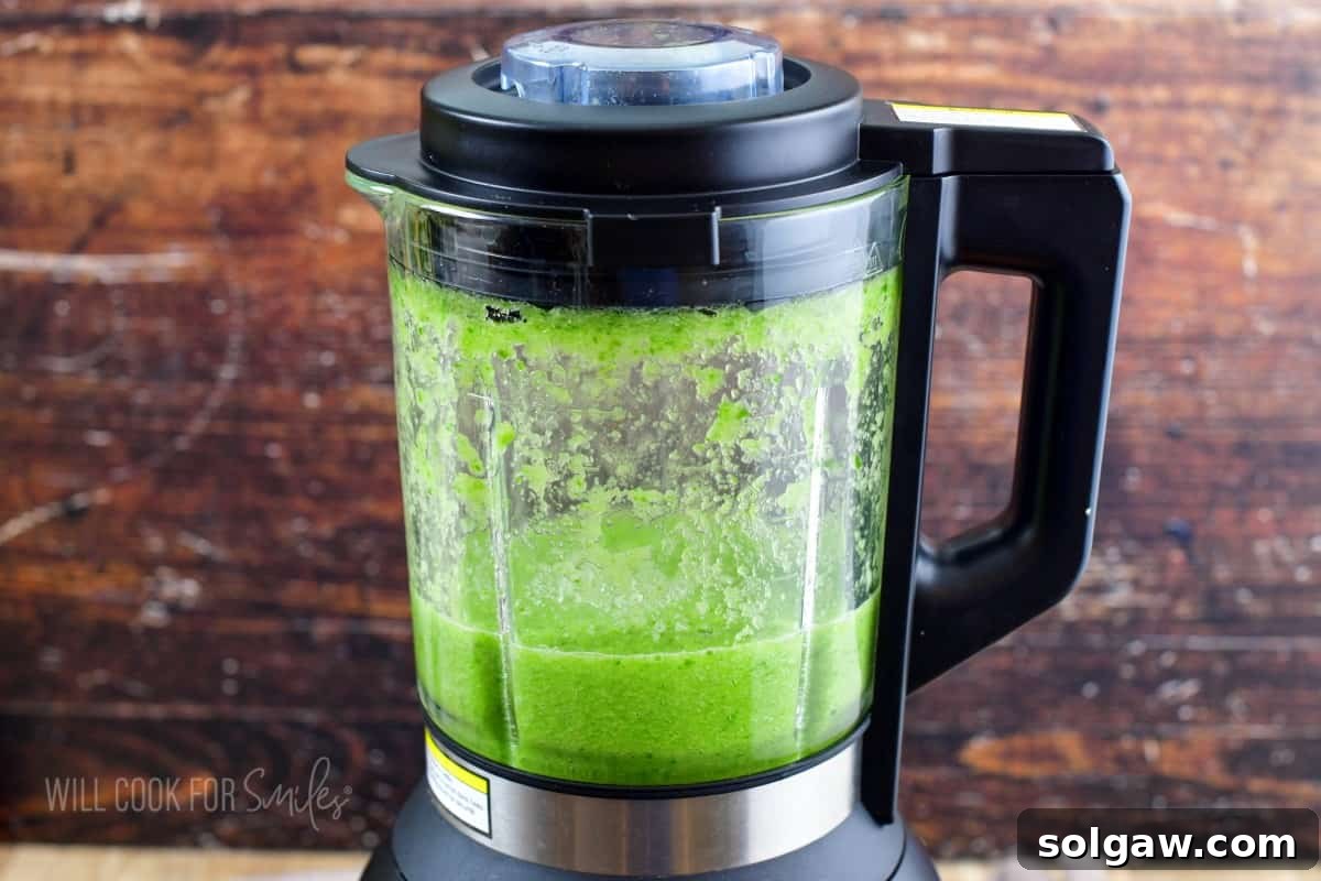 Blended cucumber puree inside a blender.