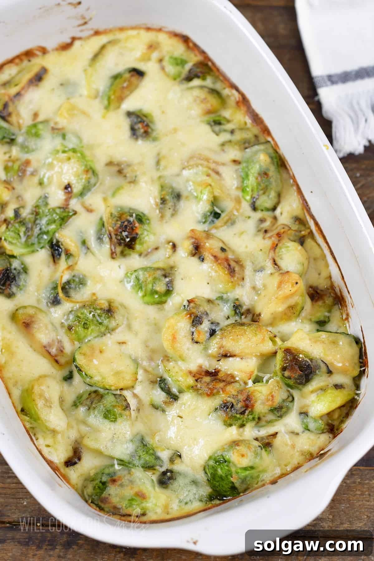 Velvety Baked Brussels Sprouts Gratin 7 top view of creamy baked brussels sprouts in a baking dish.