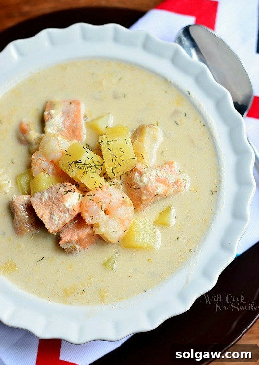 close up of Seafood Chowder Soup in a white bowl