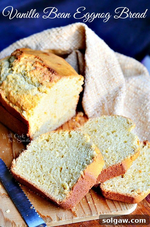 Vanilla Bean Eggnog Bread sliced on a cutting board, ready to serve