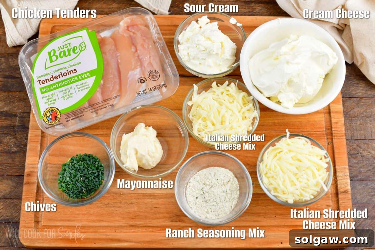 labeled ingredients to make chicken ranch dip on a cutting board.