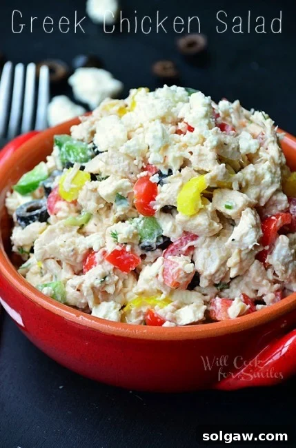 A vibrant Greek Chicken Salad with banana peppers, red peppers, and olives, served fresh.